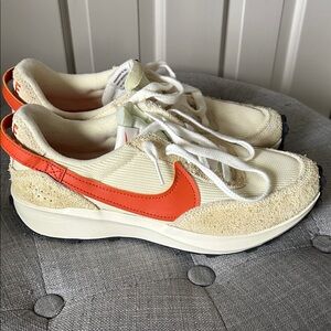 Nike Women’s Cream and White Sneakers with Orange Swoosh